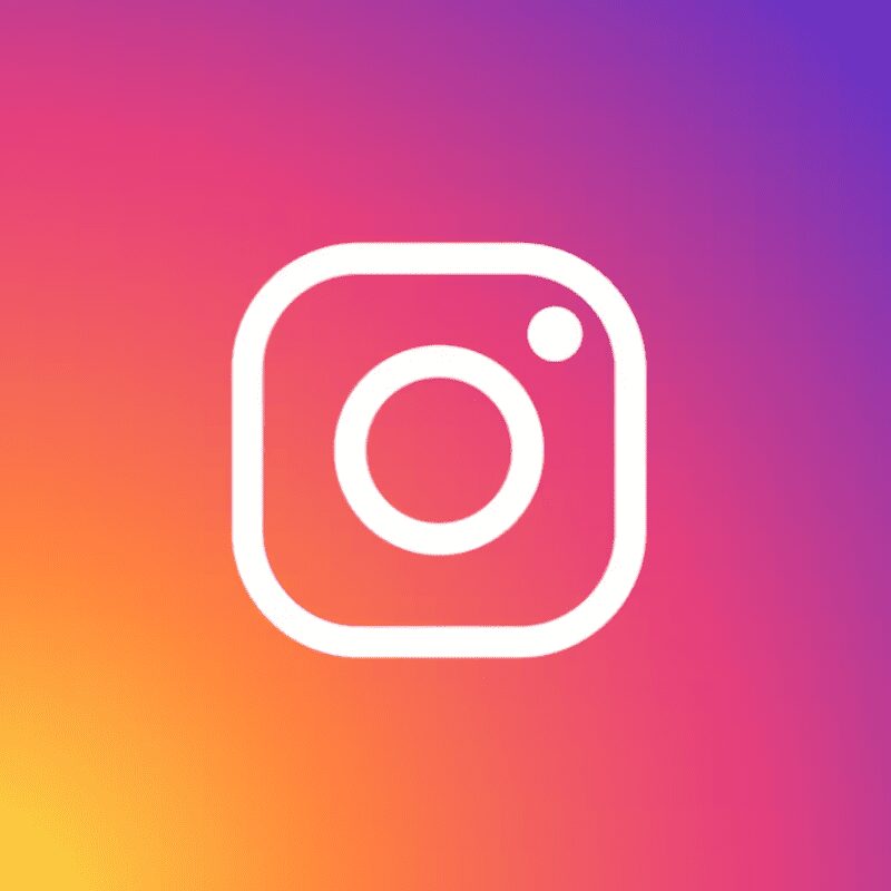 White Instagram camera logo on gradient background