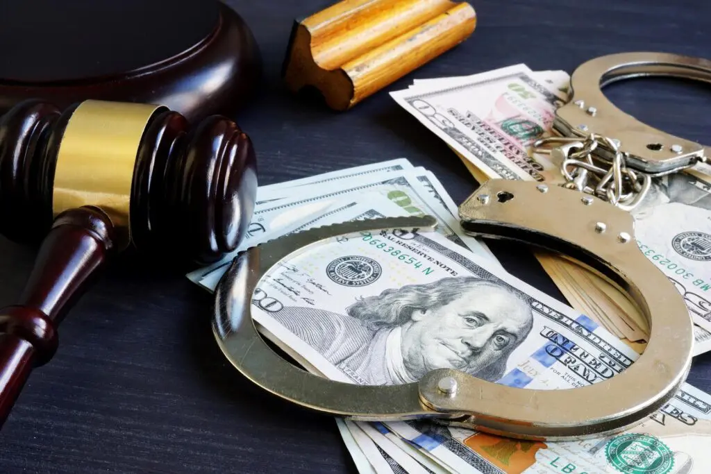 A table with handcuffs and money on it
